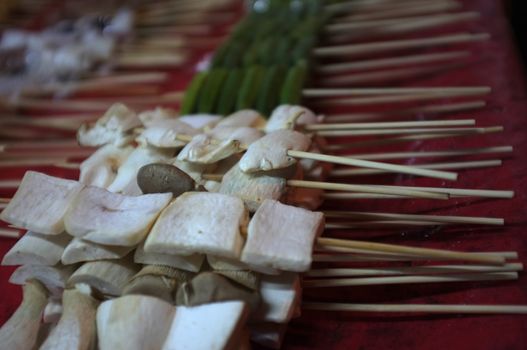 Asian street food Grilled with Chinese Sichuan Peppers (Ma-la) style , Seller prepare for meals, balls, seafoods and vegetables grill with Sichuan pepper.Thai Street food