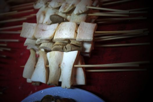 Asian street food Grilled with Chinese Sichuan Peppers (Ma-la) style , Seller prepare for meals, balls, seafoods and vegetables grill with Sichuan pepper.Thai Street food