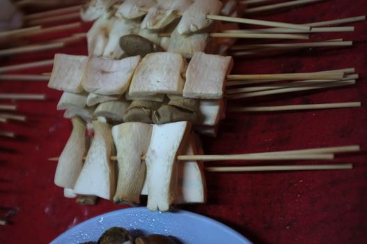 Asian street food Grilled with Chinese Sichuan Peppers (Ma-la) style , Seller prepare for meals, balls, seafoods and vegetables grill with Sichuan pepper.Thai Street food