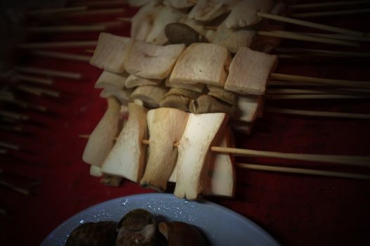 Asian street food Grilled with Chinese Sichuan Peppers (Ma-la) style , Seller prepare for meals, balls, seafoods and vegetables grill with Sichuan pepper.Thai Street food