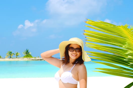 Portrait of happy young woman at  Maldives island. Travel and Vacation. 