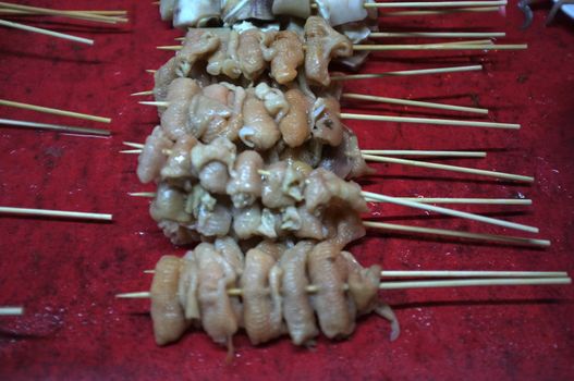 Asian street food Grilled with Chinese Sichuan Peppers (Ma-la) style , Seller prepare for meals, balls, seafoods and vegetables grill with Sichuan pepper.Thai Street food
