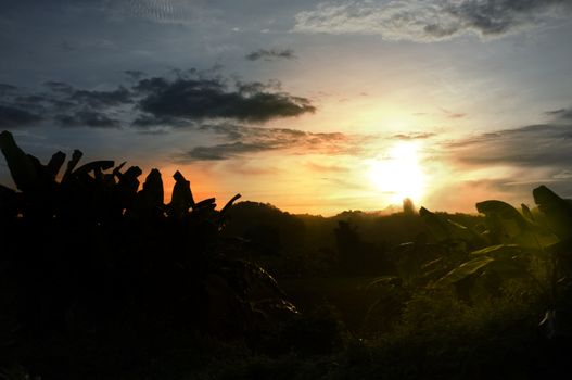 A colorful sunup above a small train station in thailand , Effect Golden light