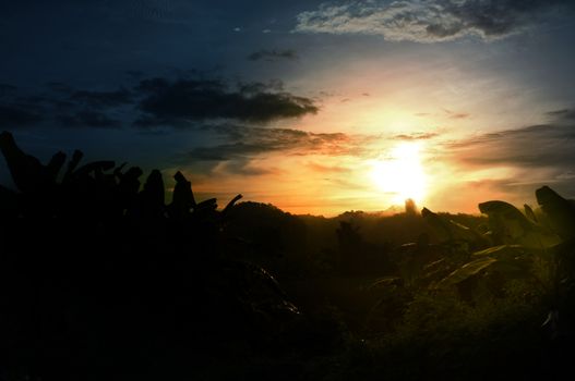 A colorful sunup above a small train station in thailand , Effect Golden light