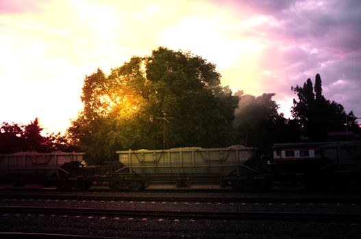 A colorful sunup above a small train station in thailand , Effect Golden light
