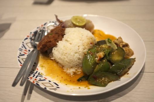 Rice and Spicy stir fry eggplant and minced pork in Rice and Curry Shop at Central Village outlet near Suvarnabhumi , Thailand