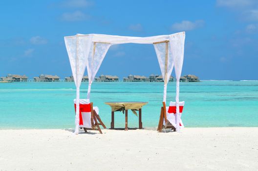 romantic luxury lunch setting at tropical beach in Maldives