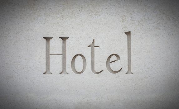 A Sign For A Luxury Contemporary Hotel Engraved In Stone
