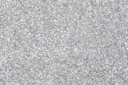 Shiny silver bokeh glitter lights abstract background, Christmas New Year party celebration concept