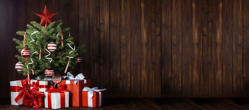 Beautiful small decorated Christmas Tree and many gifts