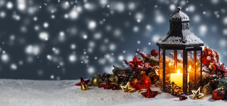 Burning candles , lantern and christmas decoration on magic bokeh lights background