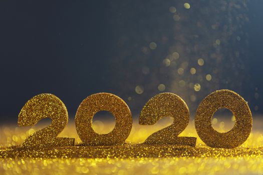 2020 New Year luxury design concept. Golden 2020 New Year horizontal template with golden glitter on blue backgound