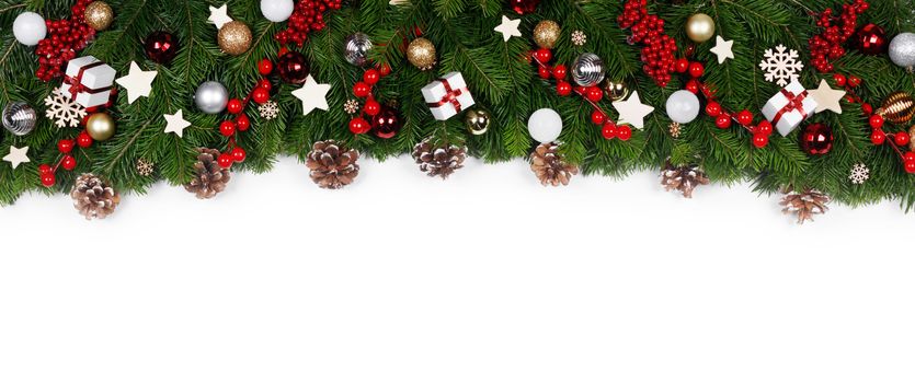 Christmas Border frame of tree branches on white background with copy space isolated, red and white decor, berries, stars, cones