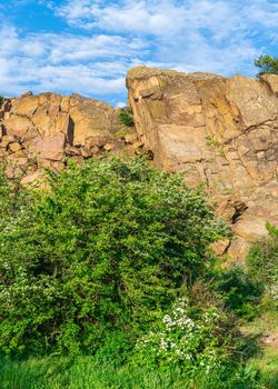 The rocky banks of the Southern Bug River near the village of Migiya in Ukraine on a sunny summer day