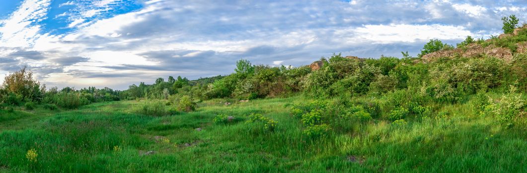 The rocky banks of the Southern Bug River near the village of Migiya in Ukraine on a sunny summer day