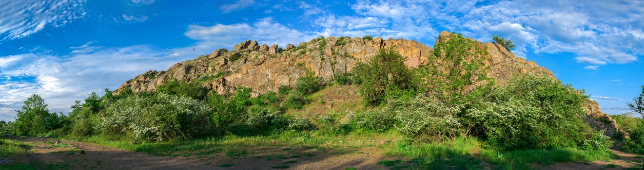 The rocky banks of the Southern Bug River near the village of Migiya in Ukraine on a sunny summer day