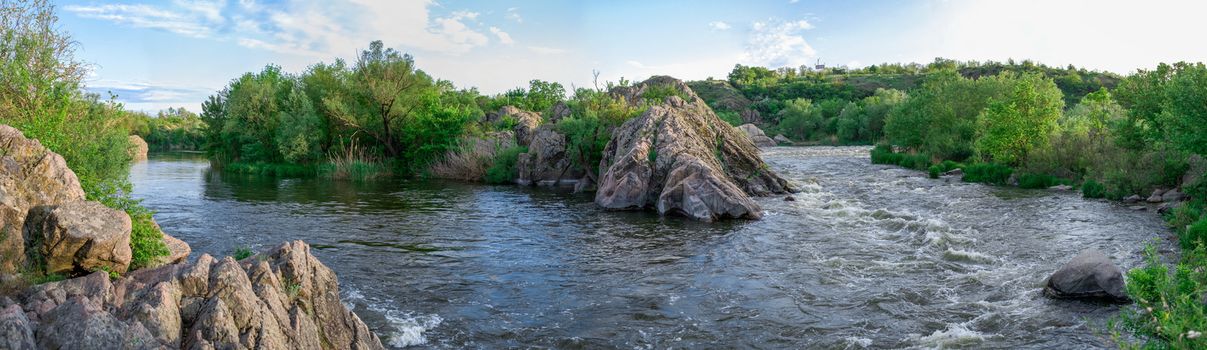 The rocky banks of the Southern Bug River near the village of Migiya in Ukraine on a sunny summer day