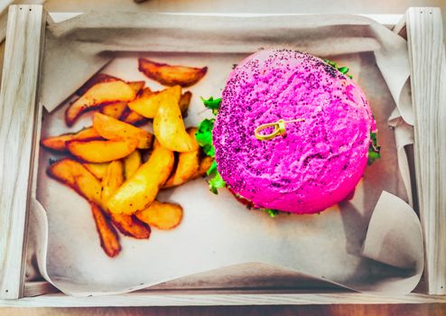pink burger vegan fast food meal box high angle view of vegetarian with fries from above .