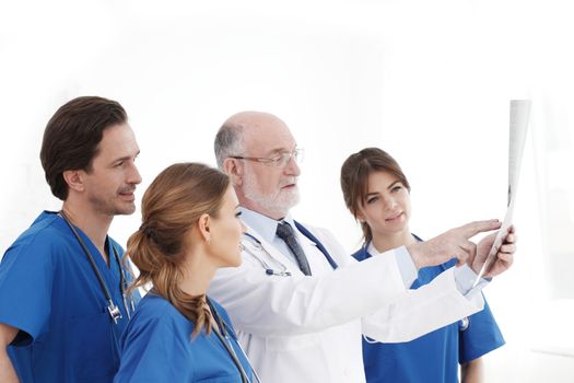 Medical team checking on X-ray results isolated on white
