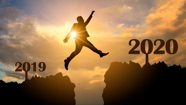 Business people are jumping across the abyss from 2019 to 2020