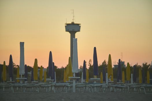 Bathing establishment now closed during the twilight with the bottom of the country and the panorama wheel. Location Rosolina Italy.