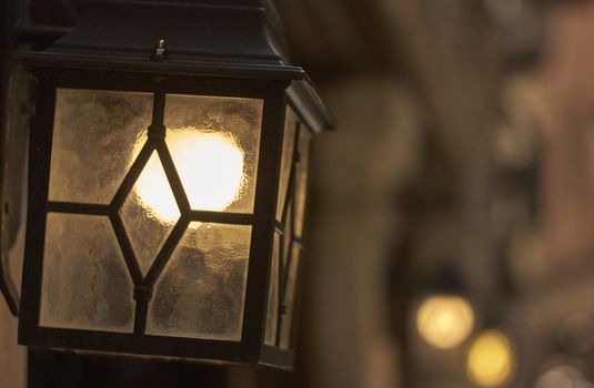 Vintage lantern used for public lighting on a typical Venice street.