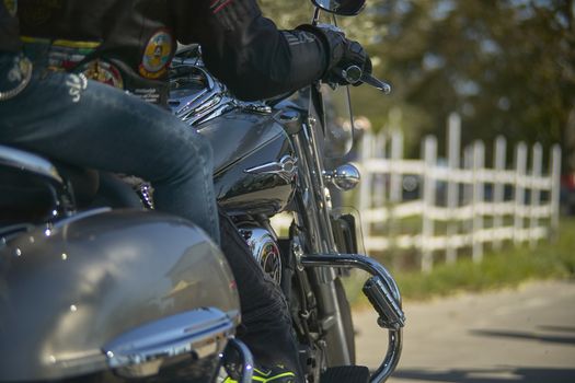 detail of a custom bike while being driven by a pair of motorcyclists to travel a long journey ...