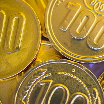 fake money - chocolate in the form of coins covered with Golden foil