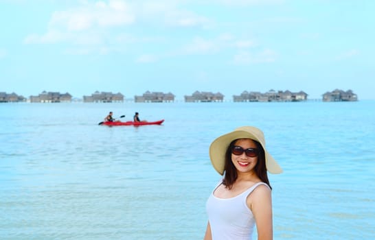 Portrait of happy and beautiful woman at  Maldives island. Travel and Vacation. 