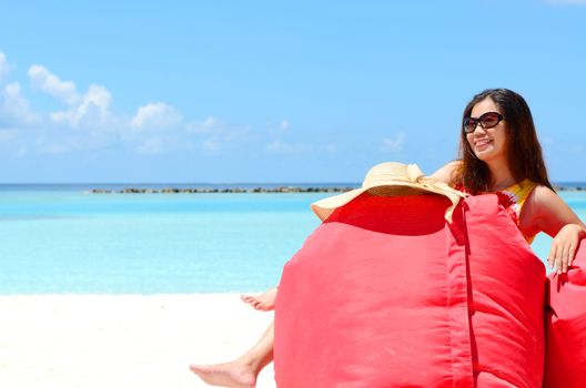 Portrait of happy young woman at  Maldives island. Travel and Vacation. 