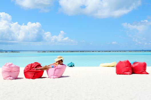 Portrait of happy young woman at  Maldives island. Travel and Vacation. 