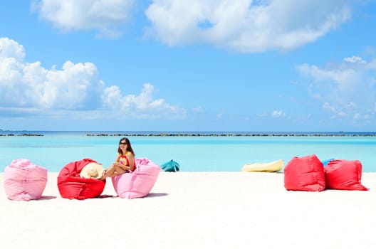 Portrait of happy young woman at  Maldives island. Travel and Vacation. 