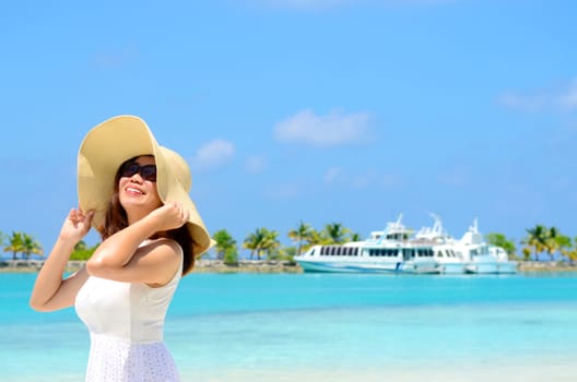 Portrait of happy young woman at  Maldives island. Travel and Vacation. 