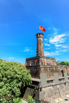 Flag tower with Vietnamese flag on top and empty standing posters. One of the symbols of the city and part of the Hanoi Citadel, a World Heritage Site. A well known destination for tourist in Vietnam