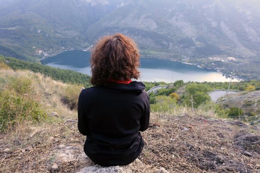 Scanno, Italy - October 12, 2019: The lake seen from Frattura with girl from behind