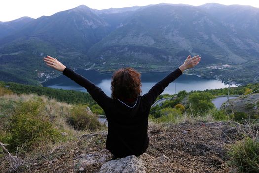 Scanno, Italy - October 12, 2019: The lake seen from Frattura with girl from behind