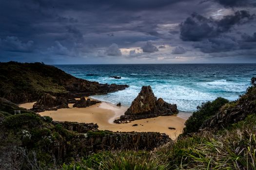 Storm skies over coastal landscape with impressive sea stacks at Bingie Australia