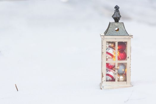 Christmas lantern in the snow.
