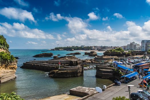 City of Biarritz with its lighthouse and these typical houses and old port in France