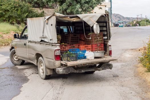 Fresh vegetables on gray van in a street of the island of Crete