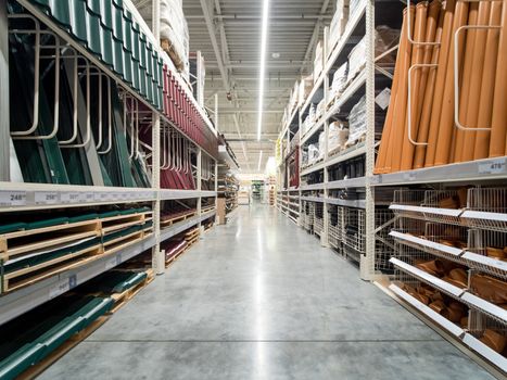 Store for home improvement and DIY. Warehouse aisle of building materials in industiral store. Shallow DOF