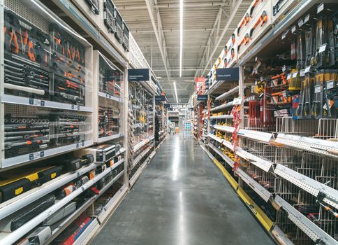 Store for home improvement and DIY. Warehouse aisle of building materials in industiral store. Shallow DOF