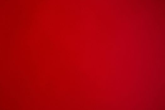 A red paper background with mottled texture