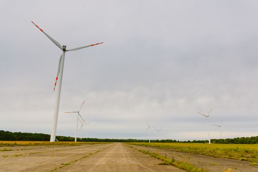 Windturbine. Eco power renewable energy production from wind. Windmill saves the earth's natural ingredients. Green ecology and pure electricity.