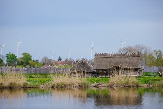 Old wooden viking huts in a village .