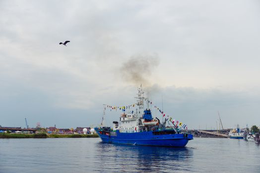Transport vessels depart from the port in Swinoujscie to the open Baltic Sea