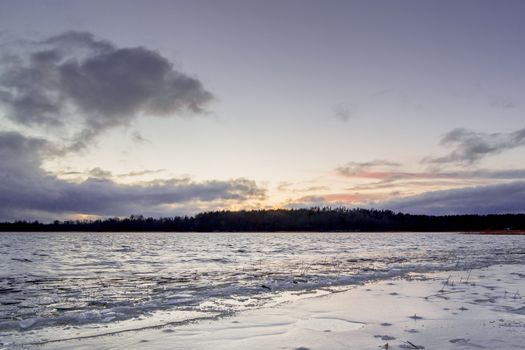 first ice on the lake in late autumn. Winter Coming Landscape.