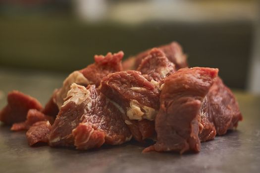 Detail of the fibers of a cut of veal with macro shot made in a butcher shop. Red meat from organic farming.