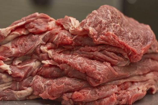 Detail of the fibers of a cut of veal with macro shot made in a butcher shop. Red meat from organic farming.