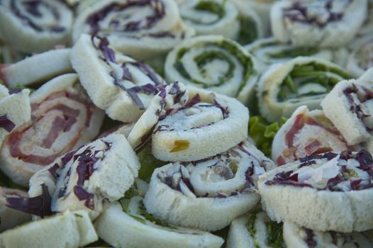 There are many round shreds in macro shot with vegetables and tuna, ideal for aperitifs and cocktail parties, a symbol of creative and typical Italian cuisine.